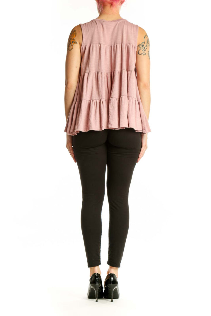 Pink tiered ruffle sleeveless tank top by Everleigh, back view on model