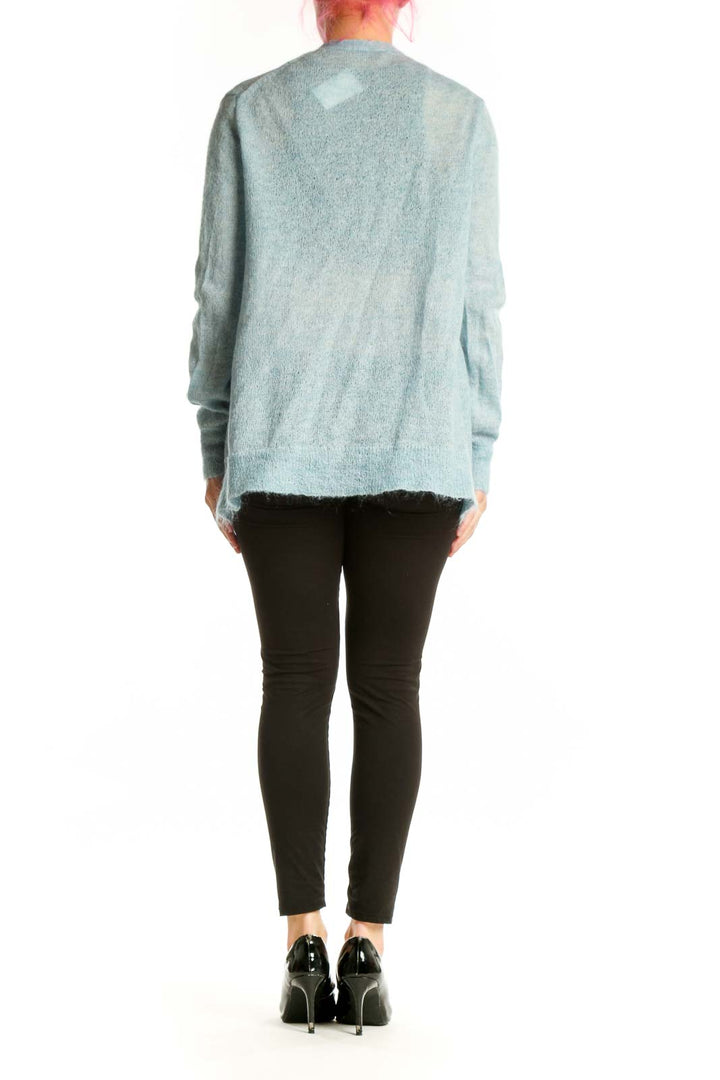 Back view of blue J.Crew mohair cardigan showing relaxed fit and drape