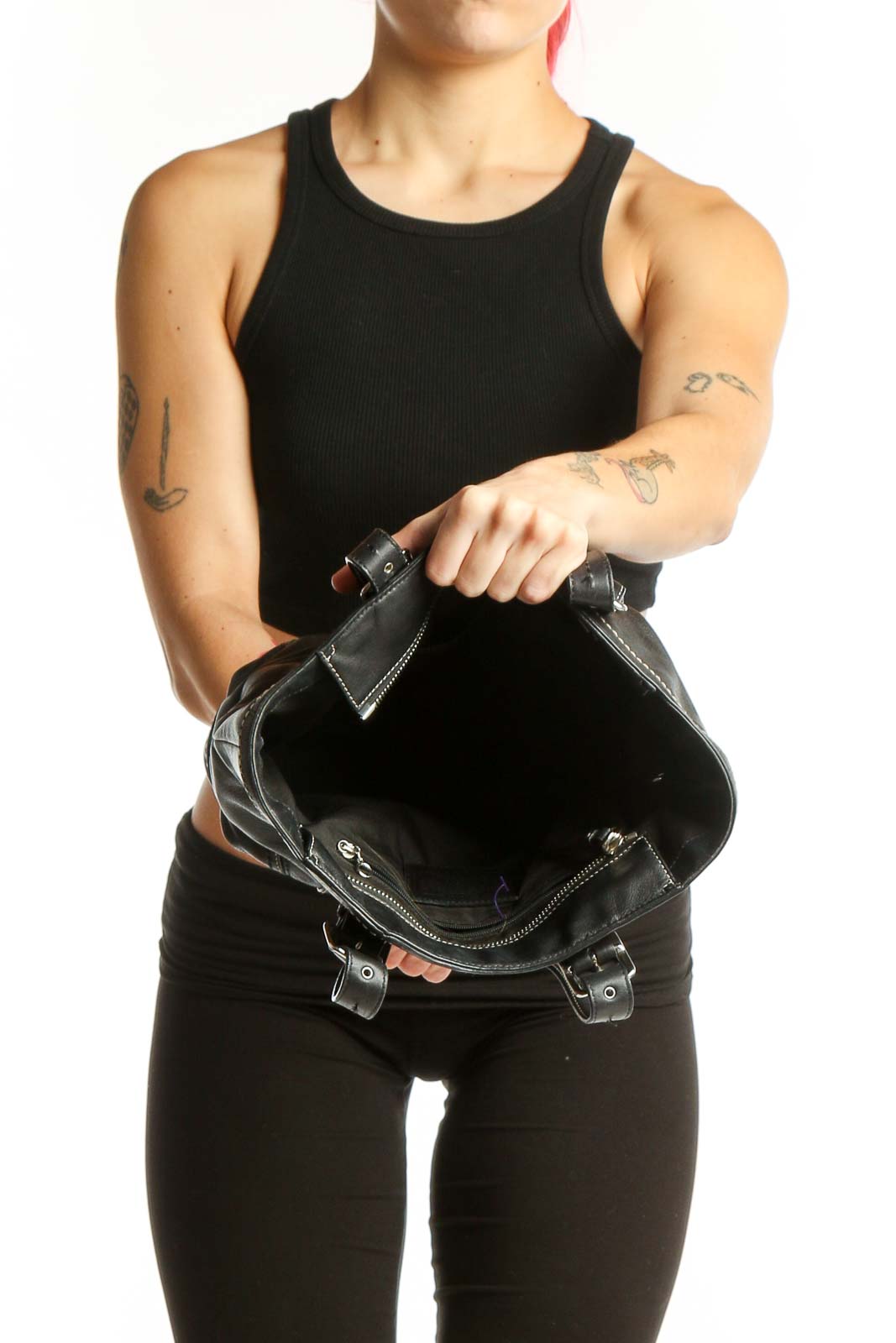 Back view of black leather Coach satchel tote showing structured design and quality craftsmanship