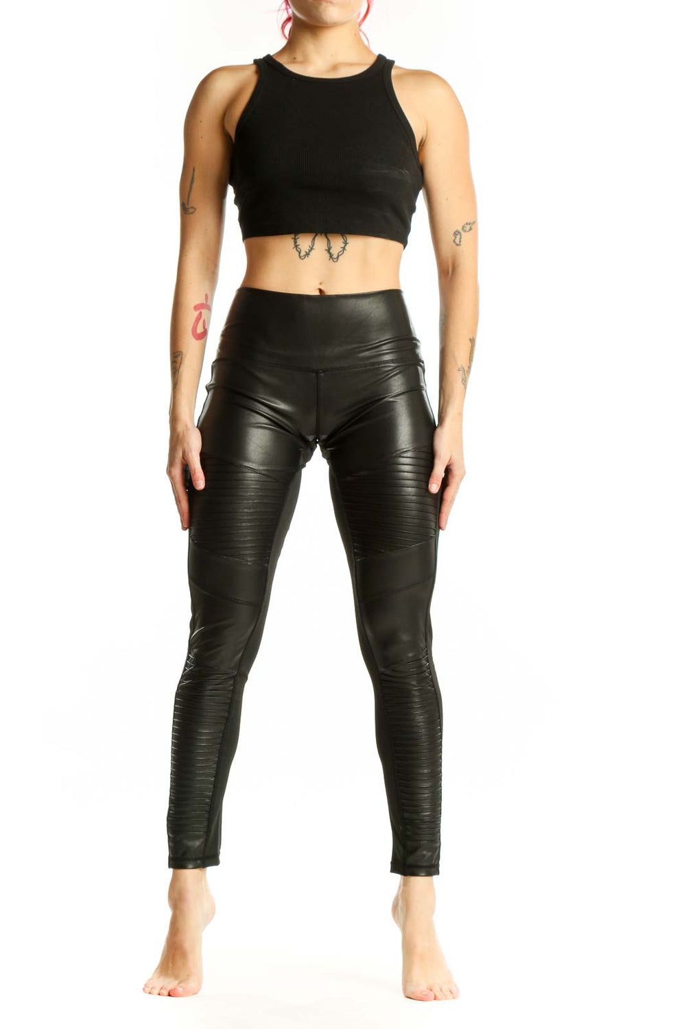 Black ruched faux leather leggings front view, high-waisted design with textured pattern