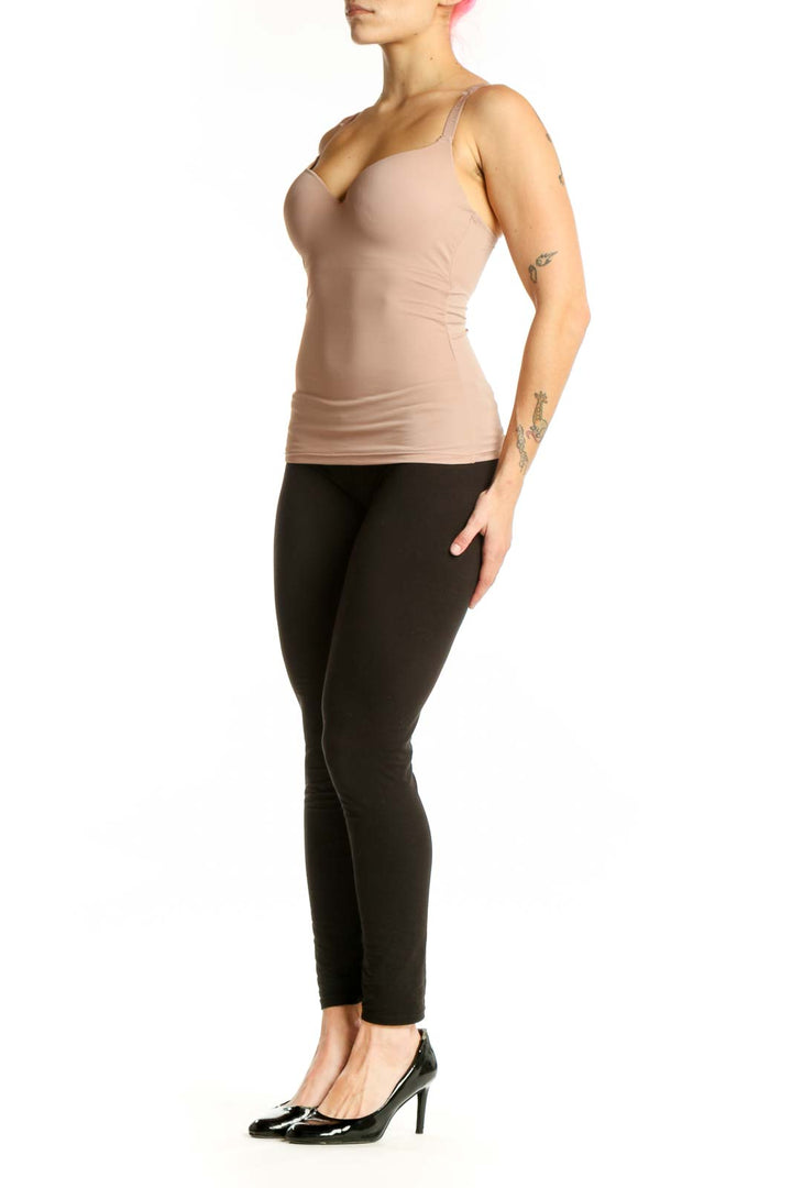 Beige fitted tank top with sweetheart neckline and ruched sides, front view