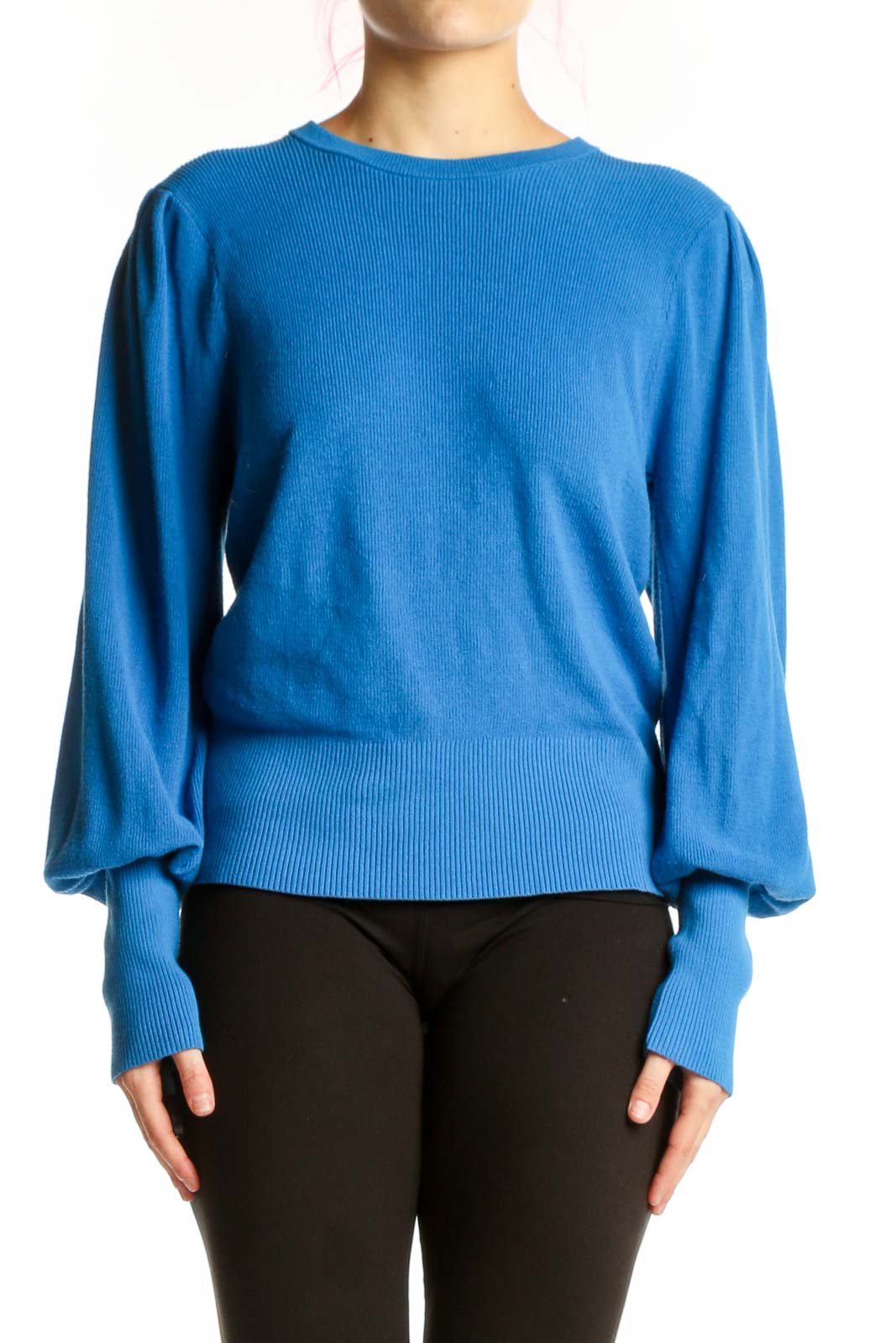 Blue puff sleeve knit pullover with cropped fit and ribbed details, worn with black pants