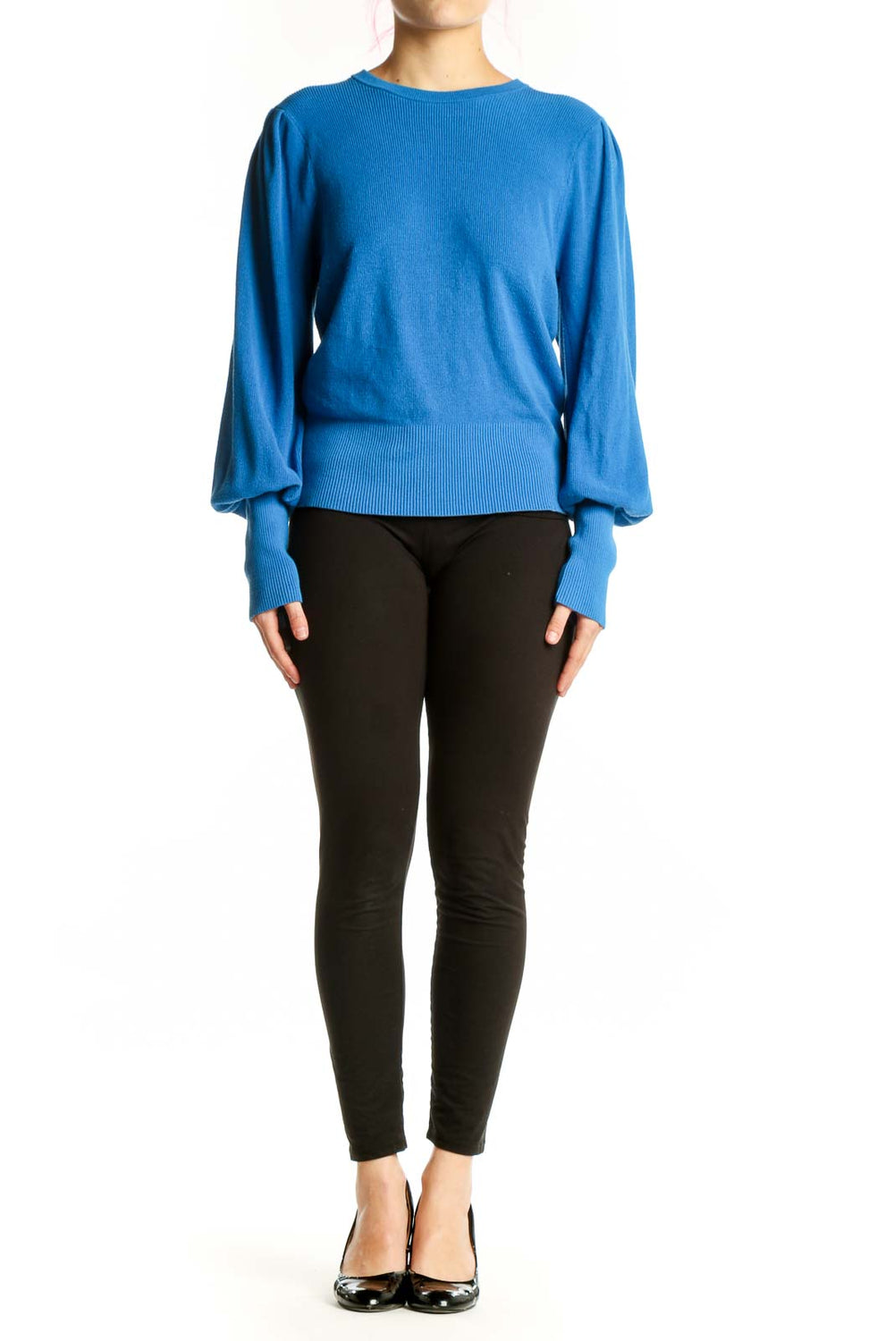 Blue puff sleeve knit pullover with cropped fit and ribbed details, worn with black pants