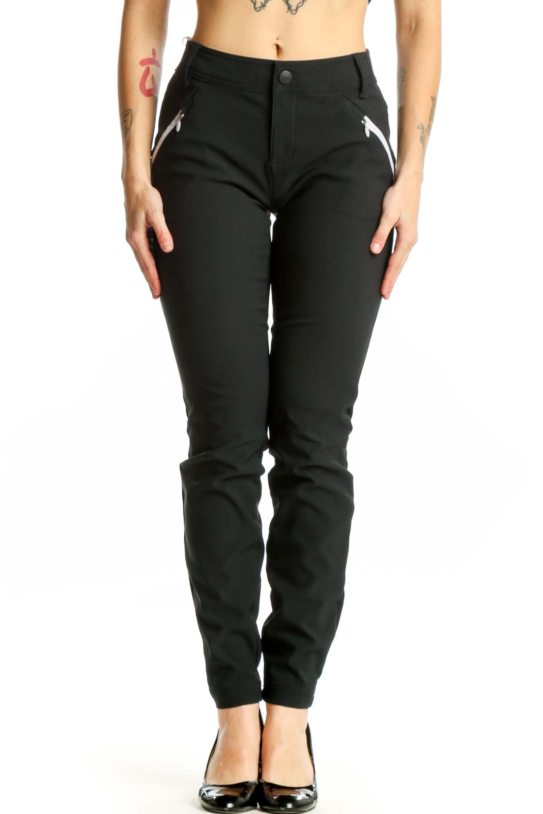 Black slim fit athletic pants front view showing tailored silhouette with side zip pockets and high waistband