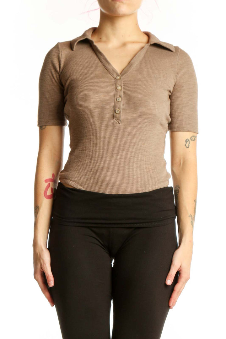 Beige ribbed henley short sleeve top with collared V-neckline and button placket, front view
