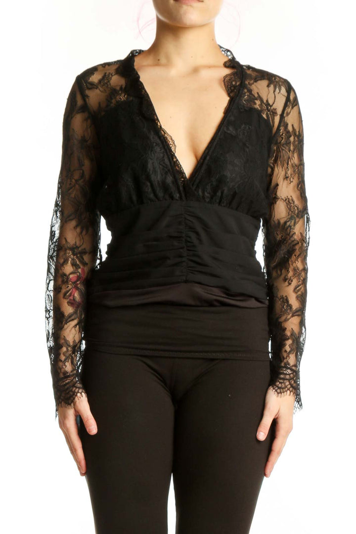 Black lace long sleeve wrap top with V-neckline and ruched waist detail, front view