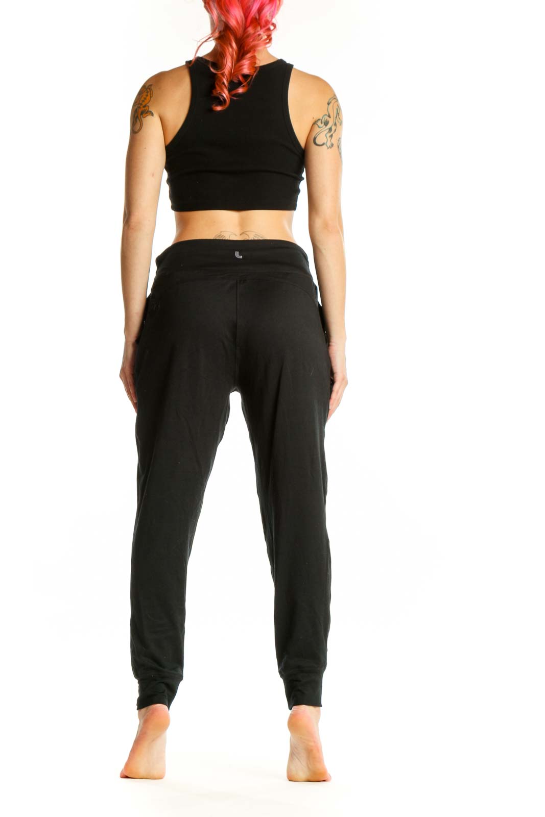 LOLE black jogger pants with drawstring waist and side pockets, back view on model