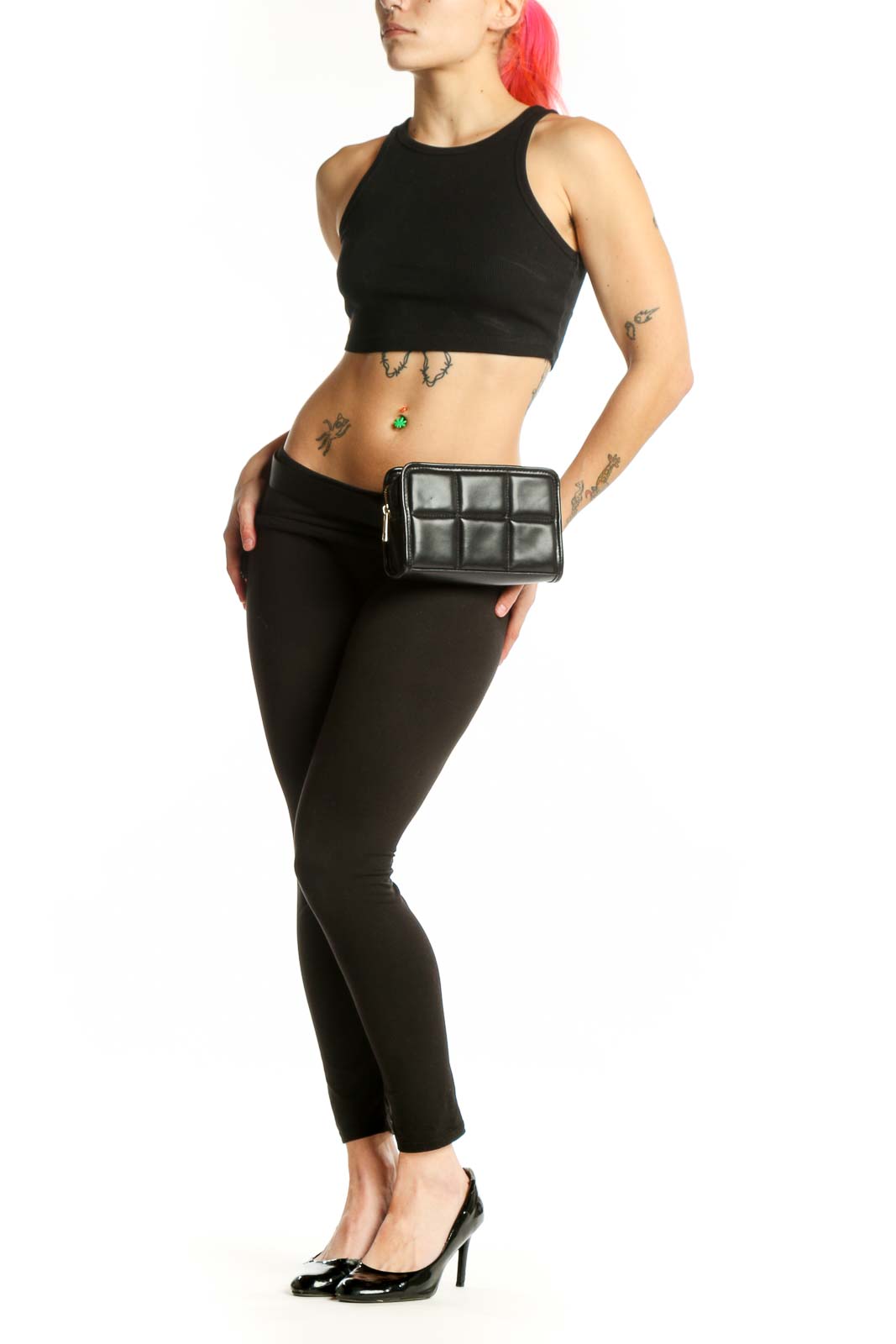 Black quilted crossbody bag with 3x3 grid pattern and zip closure by Amanda Uprichard