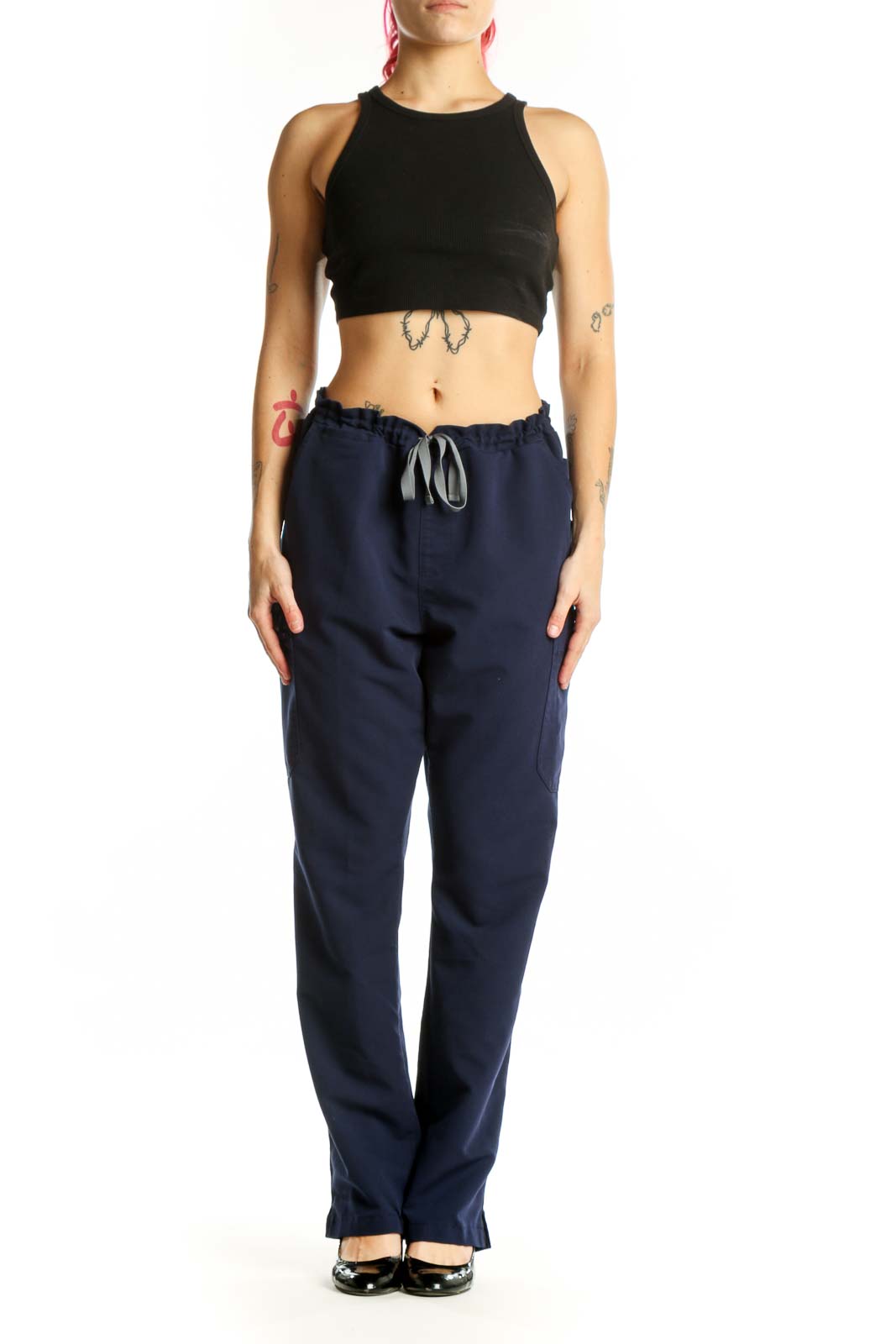 Navy drawstring scrub pants with side pockets, front view on model