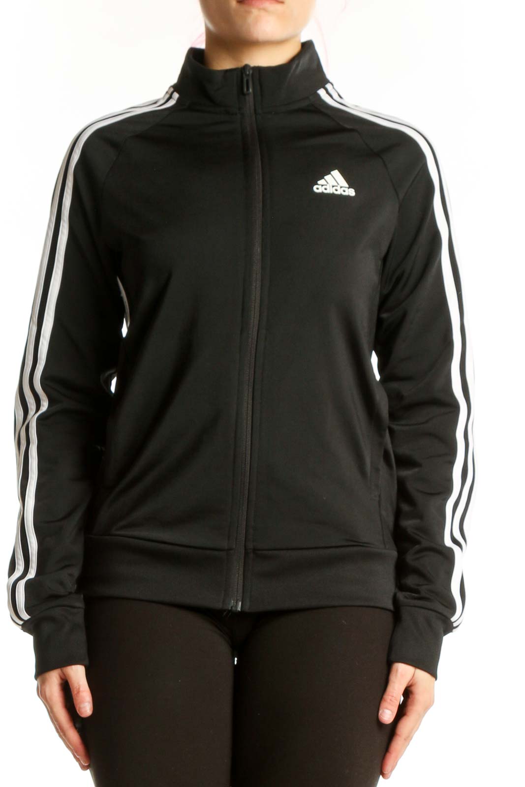 Black Adidas track jacket with white three stripes, front view on model