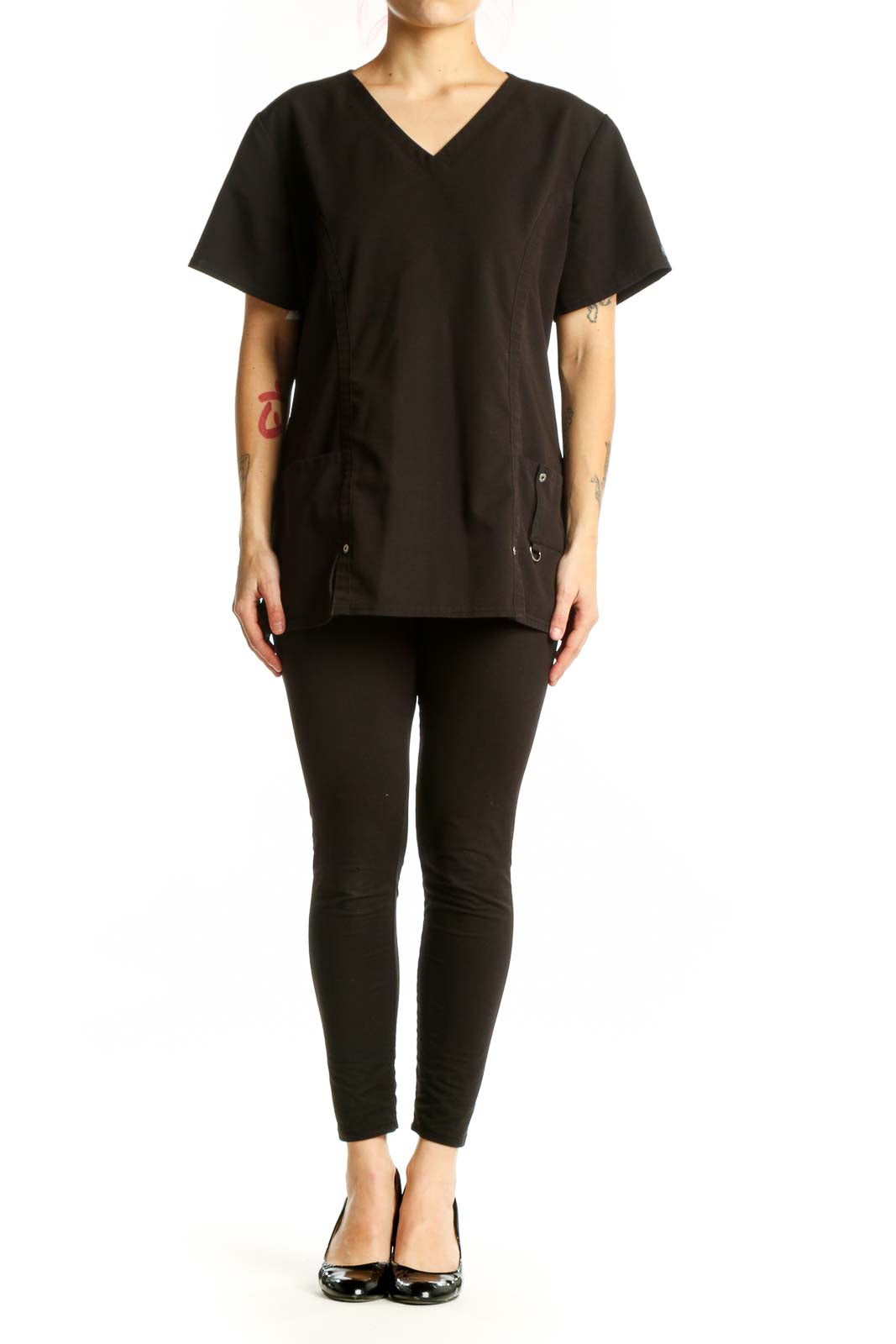 Black V-Neck Medical Scrub Top by Dickies with side pockets and drawstring details, front view on model