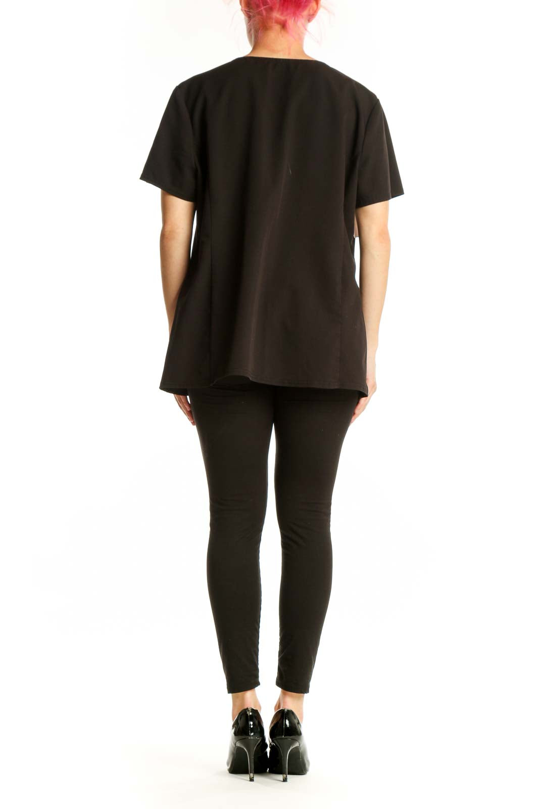 Black V-Neck Medical Scrub Top by Dickies with functional pockets, back view on model
