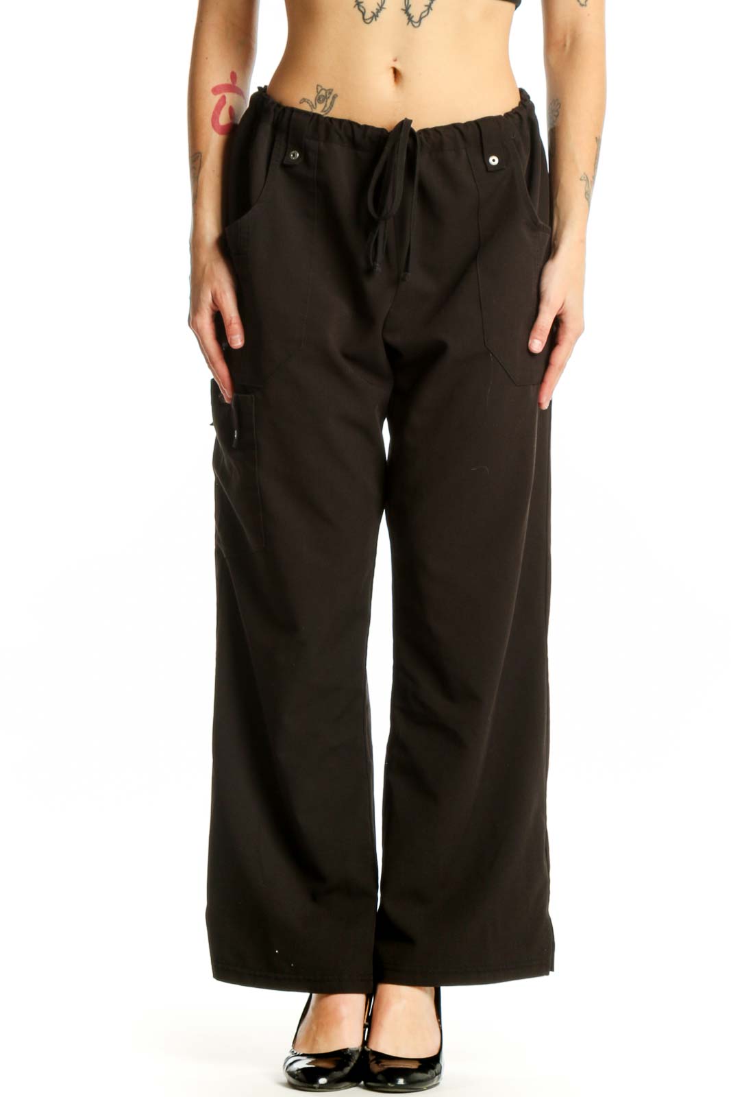 Black cargo pants with drawstring waist and side pockets, front view on model