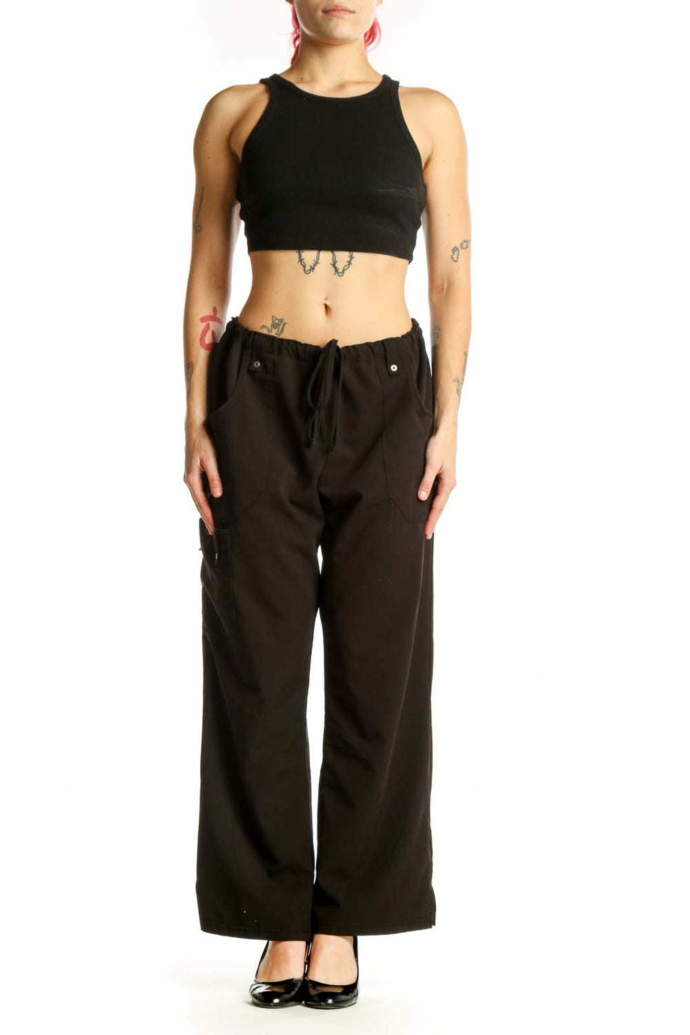 Black cargo pants with drawstring waist and side pockets, front view on model