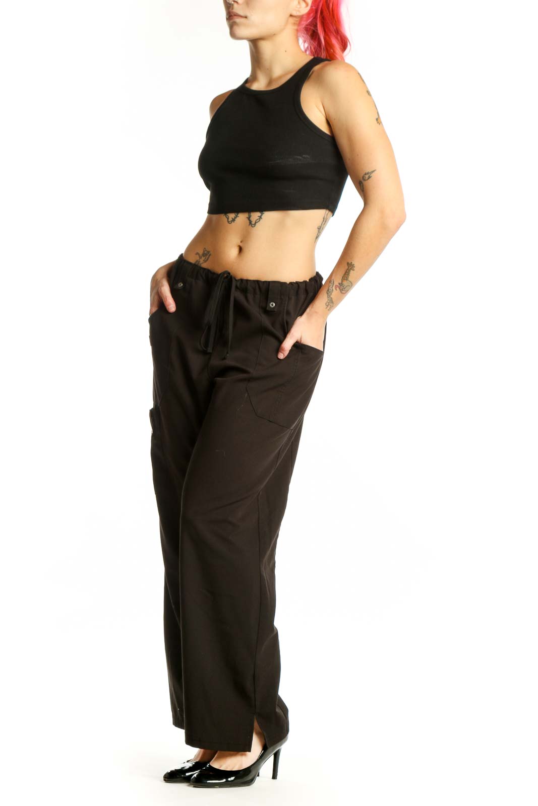 Black cargo pants with drawstring waist and side pockets, front view on model