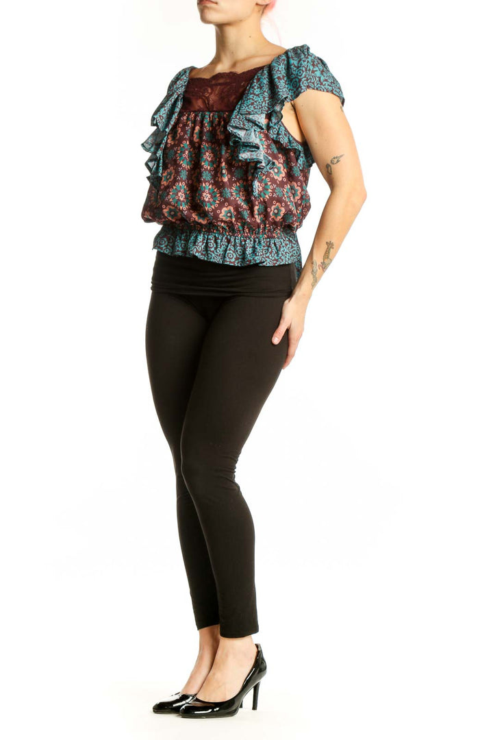 Burgundy and teal floral off-shoulder top with ruffled sleeves and lace yoke detail, front view