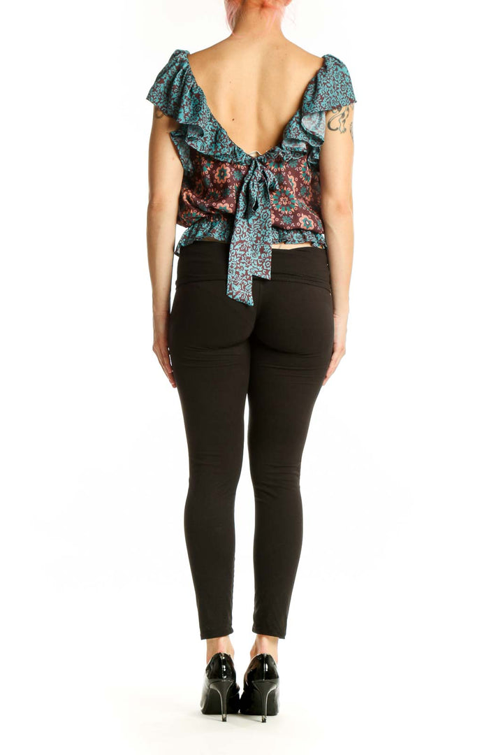 Burgundy and teal floral off-shoulder top with ruffled sleeves, back view showing gathered waist