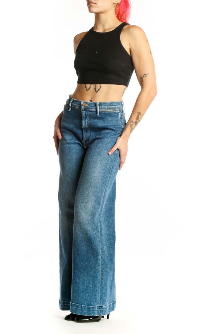 Front view of Mother blue wide-leg denim jeans with high-rise waist and classic five-pocket styling