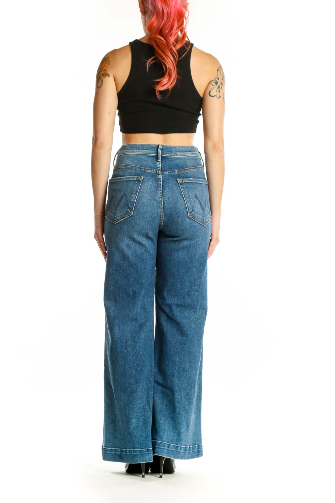 Back view of Mother blue wide-leg denim jeans showing relaxed fit and vintage wash detail