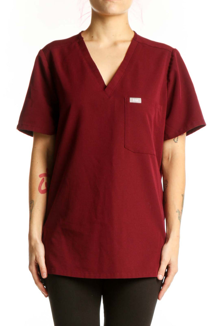 FIGS Burgundy V-Neck Medical Scrub Top front view, size L, featuring chest pocket and short sleeves