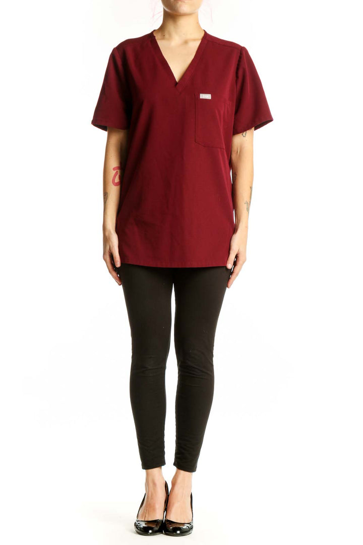 FIGS Burgundy V-Neck Medical Scrub Top front view, size L, featuring chest pocket and short sleeves