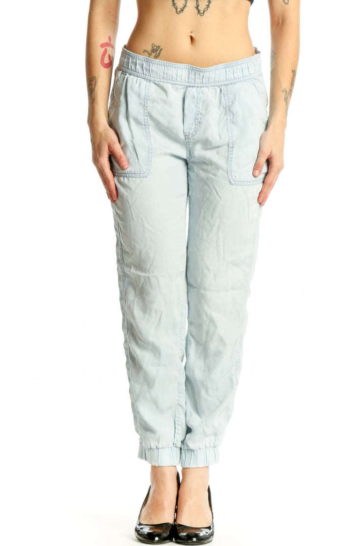 Front view of light blue Tencel cargo jogger pants with elastic waistband and side cargo pockets