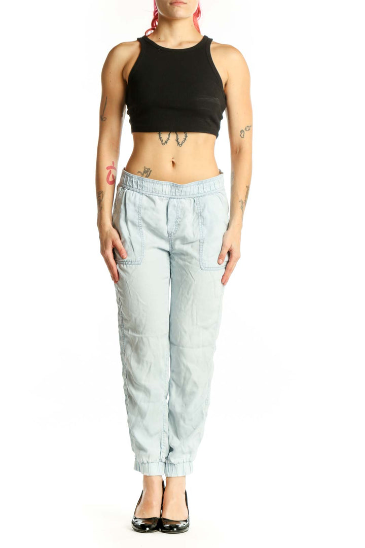 Front view of light blue Tencel cargo jogger pants with elastic waistband and side cargo pockets