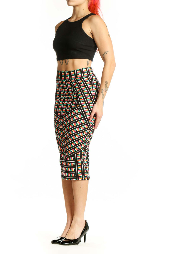 Front view of multicolor geometric pleated midi skirt with bold striped pattern and angular block design