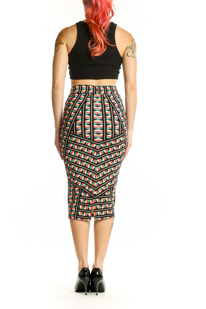 Back view of multicolor geometric pleated midi skirt showing structured pleats and geometric pattern details