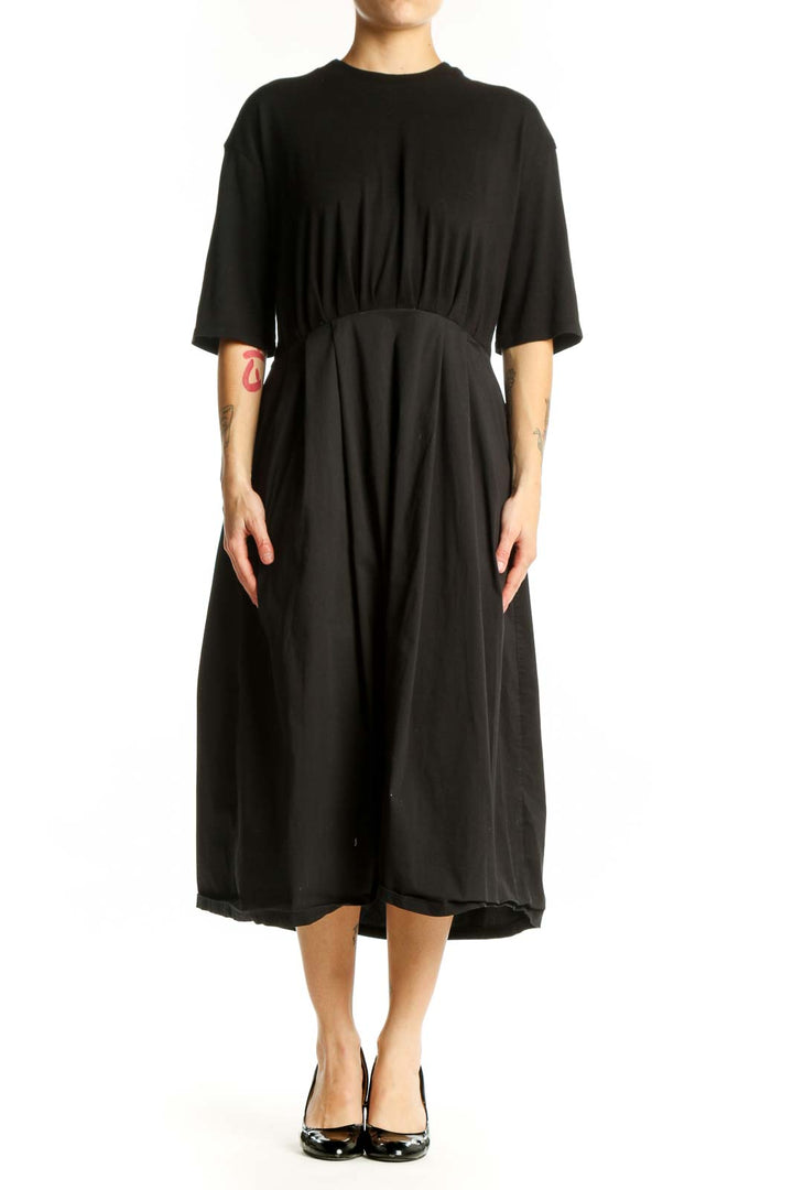 Black midi dress with cinched waist and three-quarter sleeves, front view