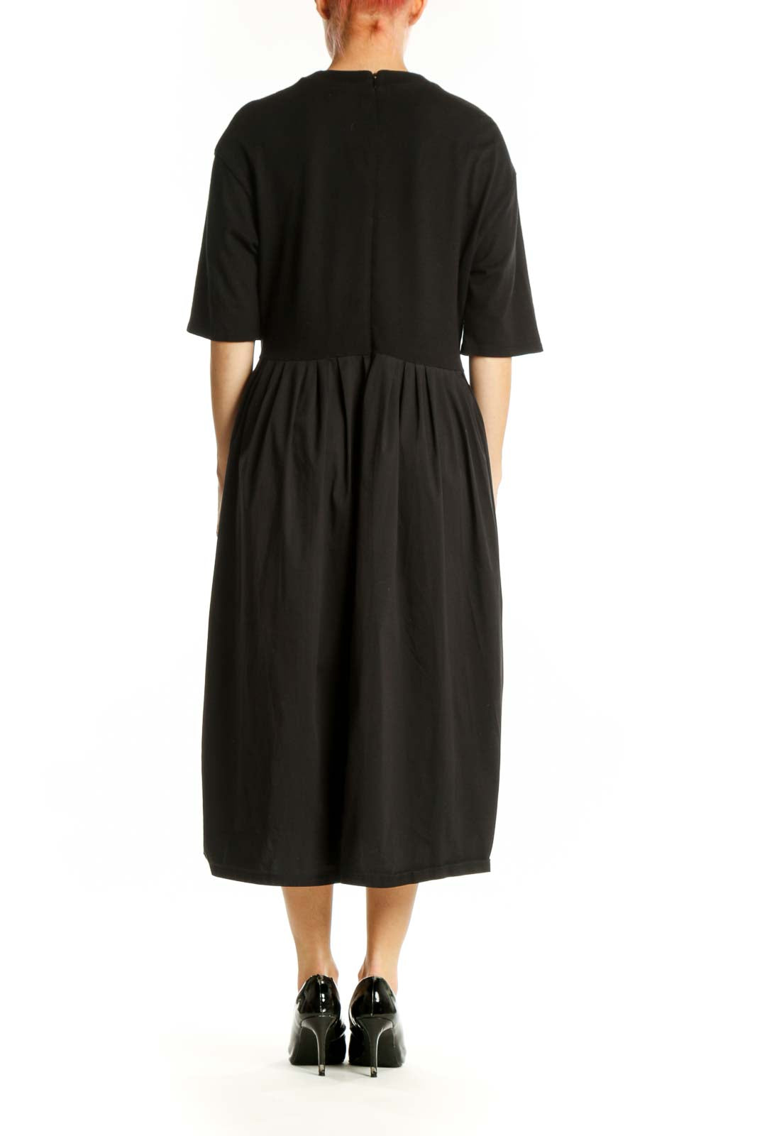 Black midi dress with cinched waist and three-quarter sleeves, back view