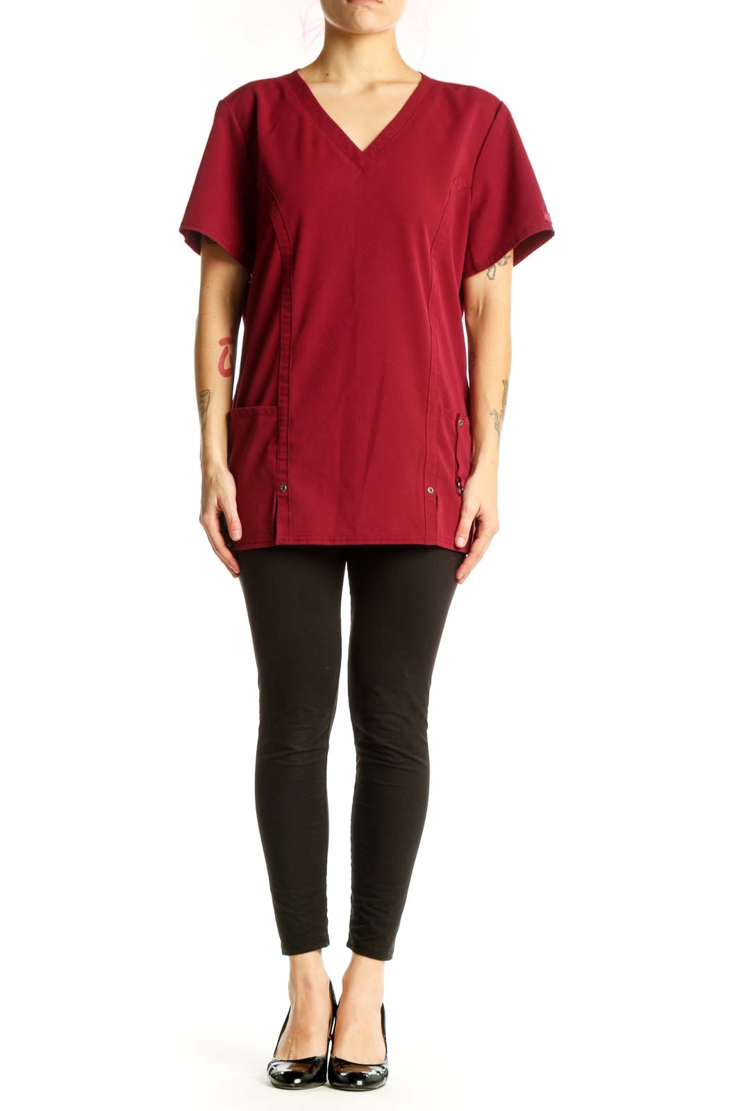 Burgundy v-neck short sleeve top with side pockets and button details, front view on model