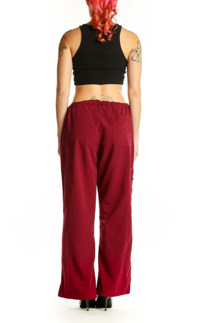 Back view of burgundy Dickies cargo pants showing wide-leg fit and cargo pocket details