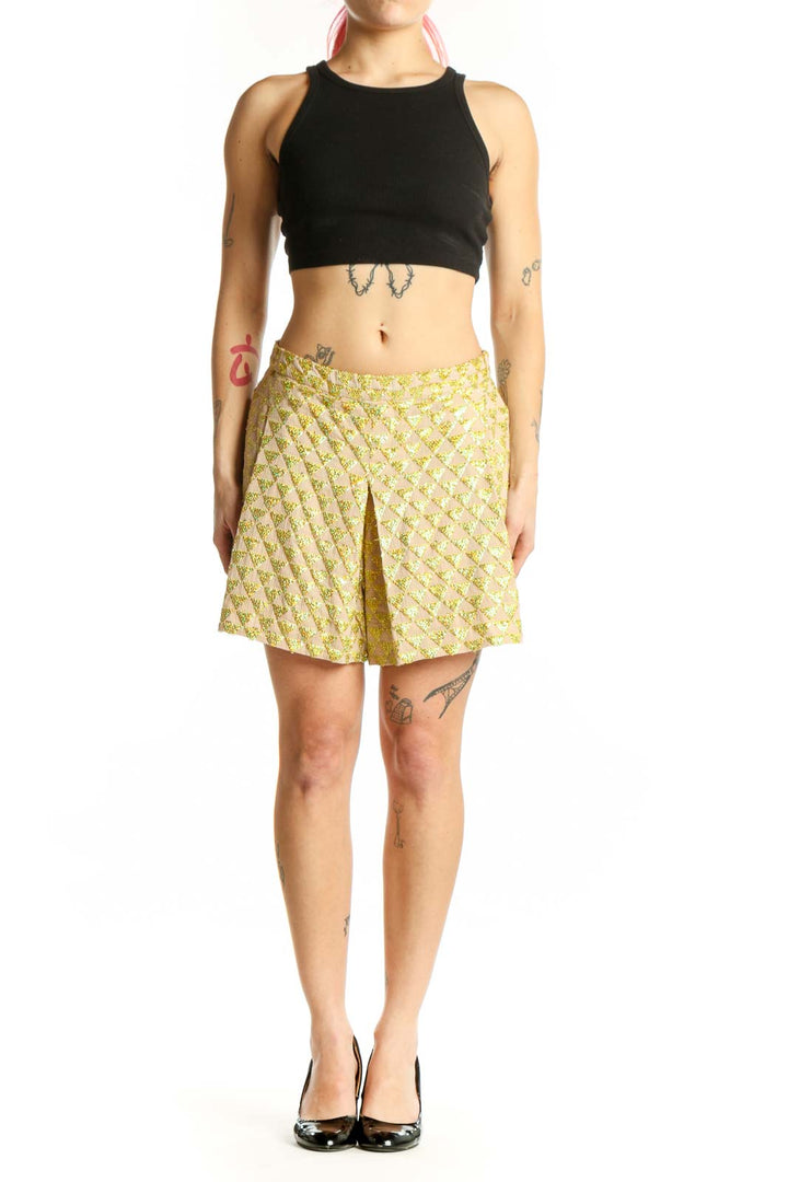 Front view of yellow floral print cotton shorts with A-line silhouette and front pleat detail