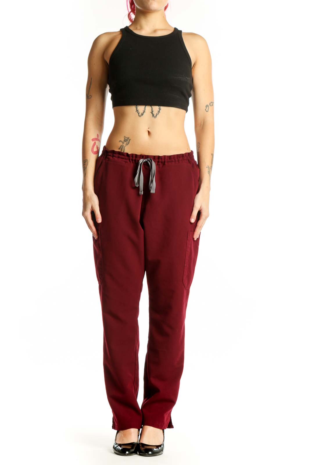 Front view of burgundy drawstring cargo pants with side pockets and elastic waistband