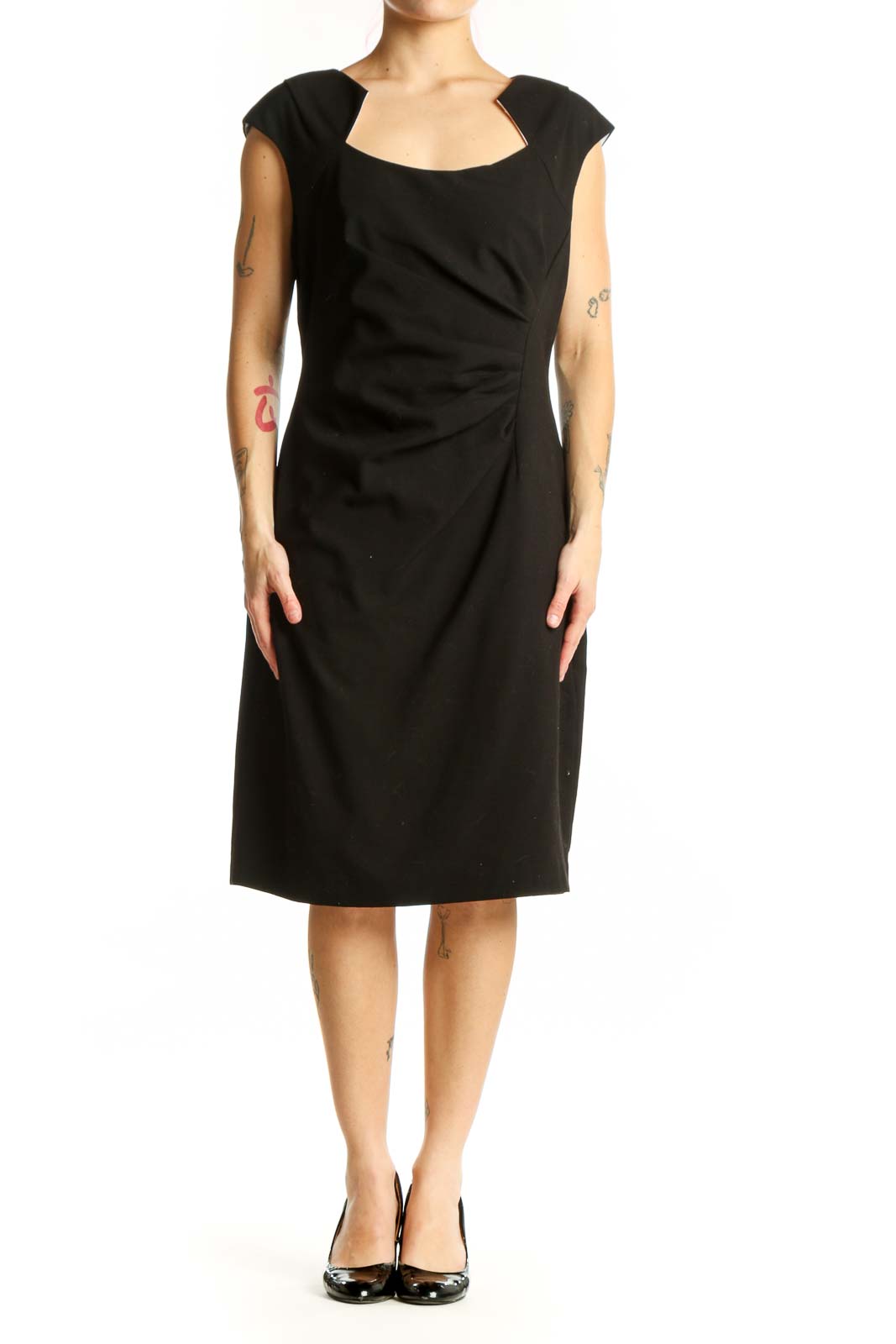 Black ruched cap sleeve dress with scoop neckline, front view on model