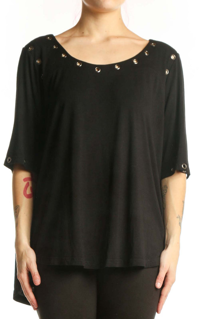 Black studded half sleeve top with metal studs on neckline and cuffs, front view on model