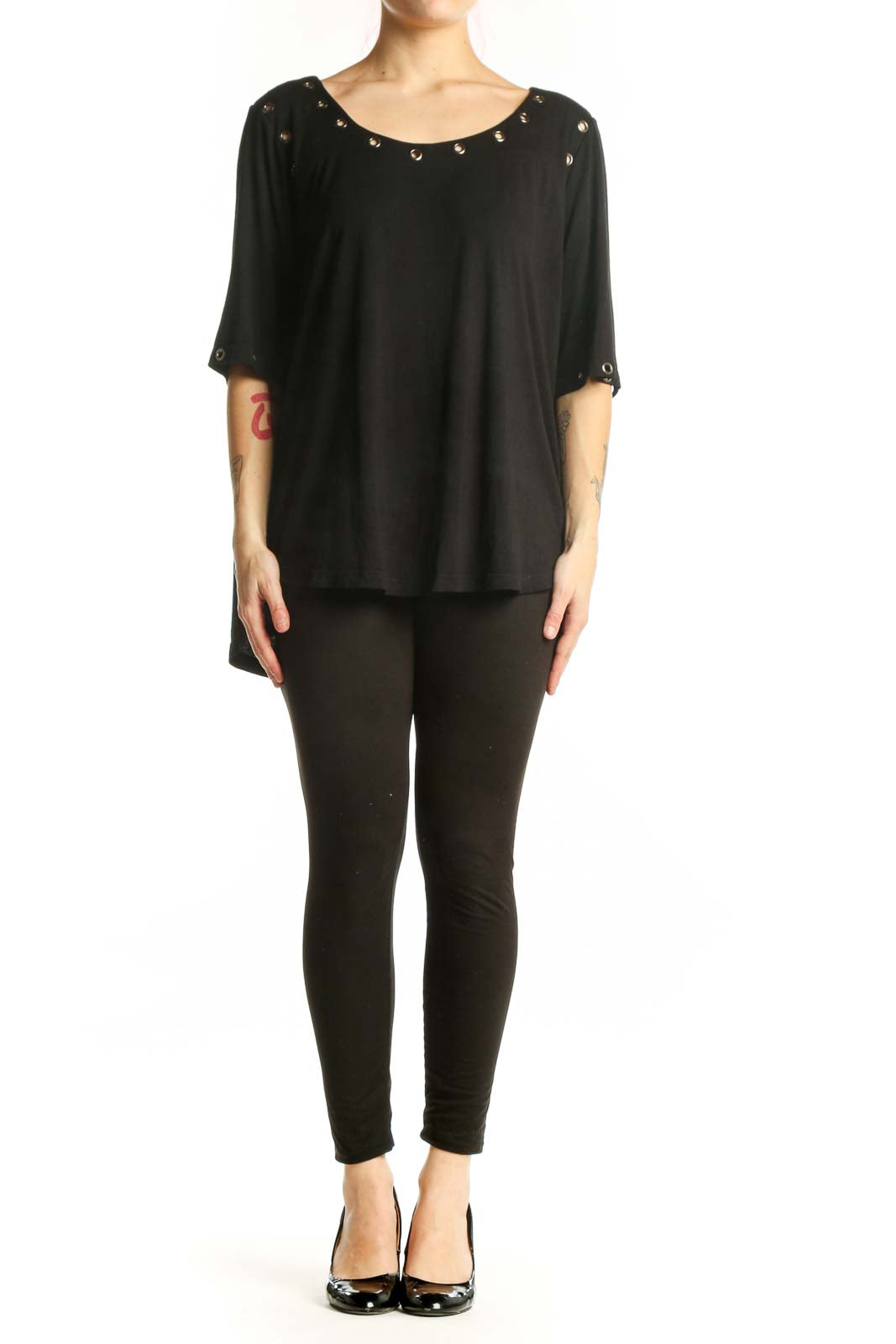 Black studded half sleeve top with metal studs on neckline and cuffs, front view on model