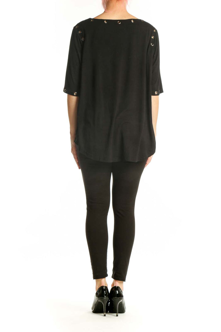 Black studded half sleeve top with metal studs, back view showing relaxed A-line silhouette