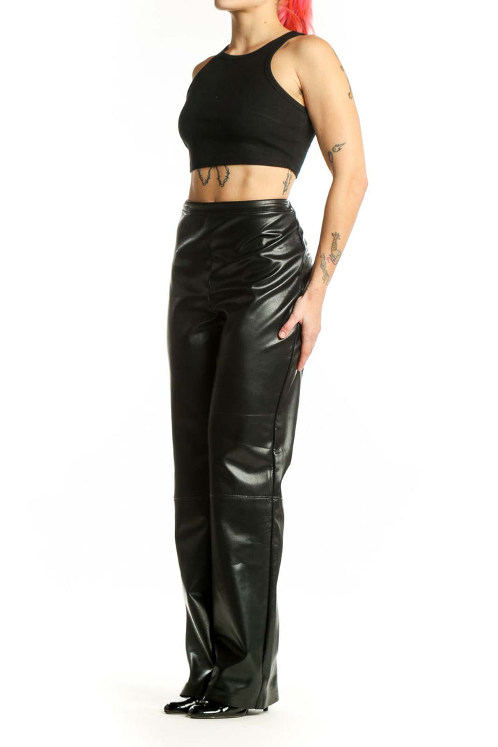Black faux leather high-waisted straight-leg pants by Joseph Ribkoff, front view on model