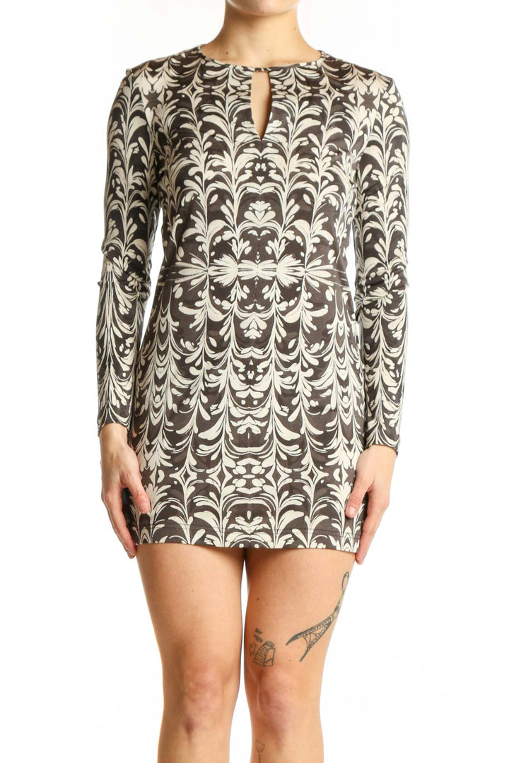 Cream damask print Tory Burch silk dress with long sleeves and keyhole neckline, front view