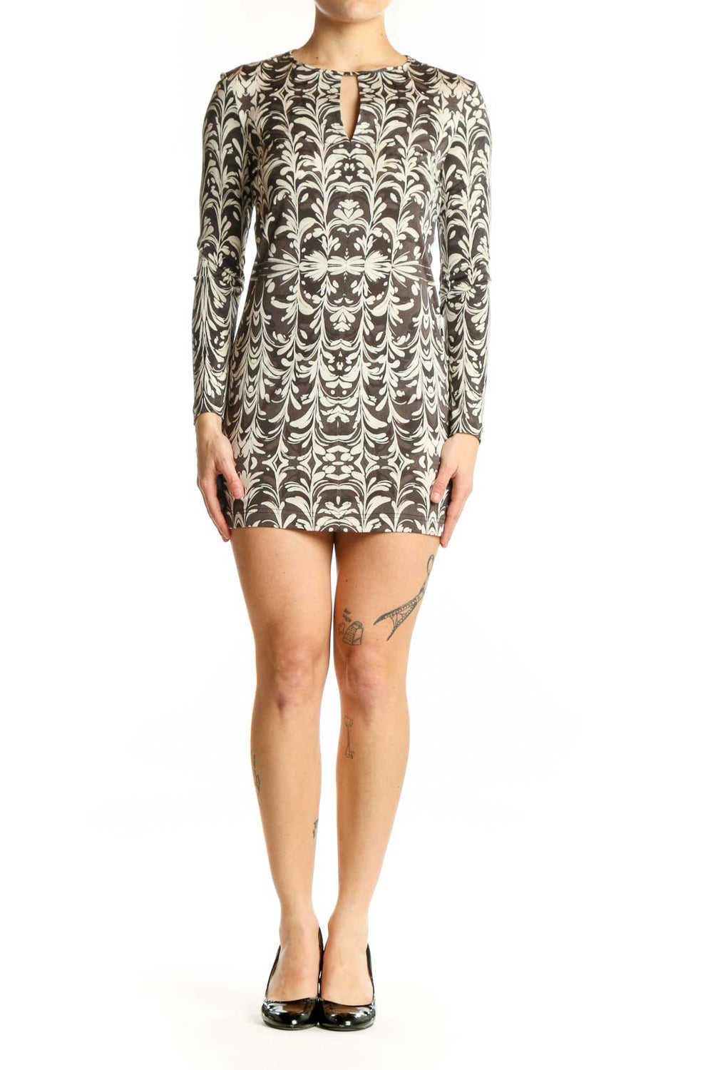 Cream damask print Tory Burch silk dress with long sleeves and keyhole neckline, front view