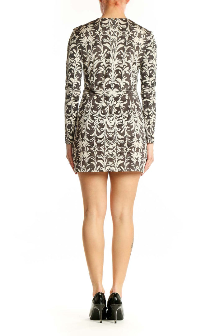 Cream damask print Tory Burch silk dress with long sleeves and belted waist, back view