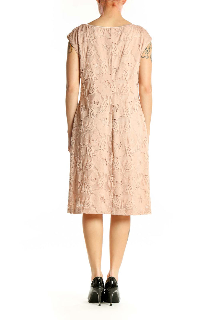 Beige lace shift dress back view showing elegant lace design and relaxed A-line silhouette