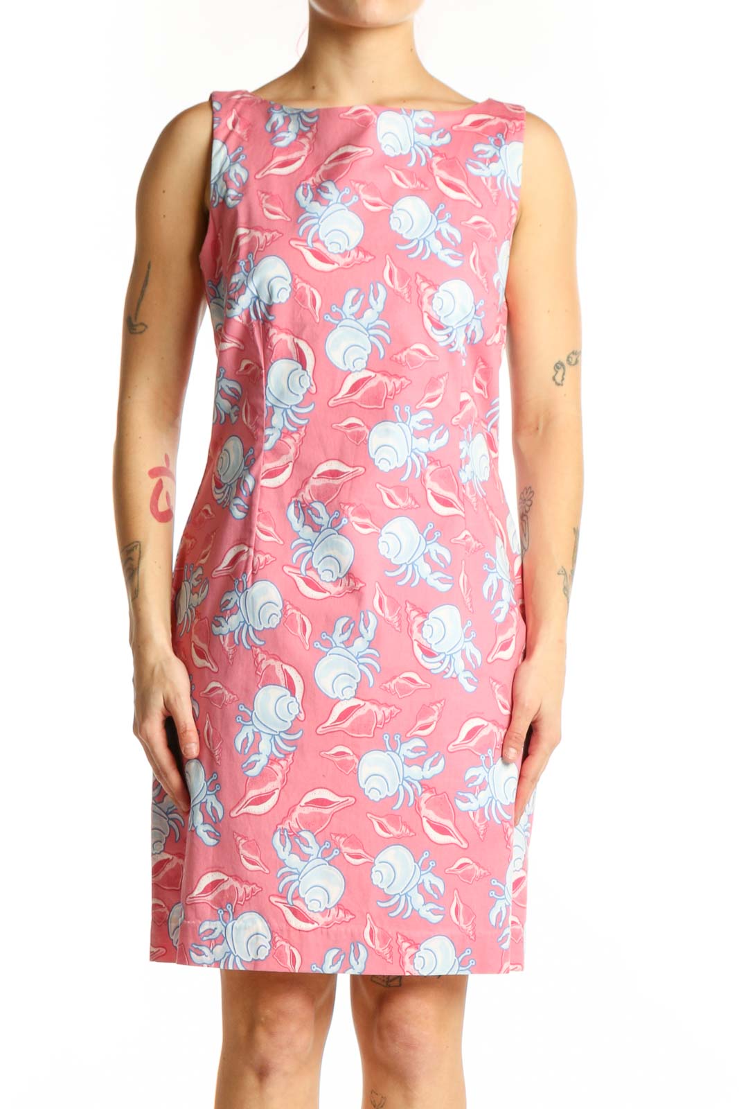 Pink floral sleeveless dress with blue and white flowers, boat neckline, front view