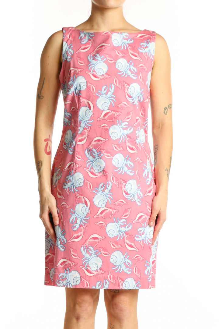 Pink floral sleeveless dress with blue and white flowers, boat neckline, front view