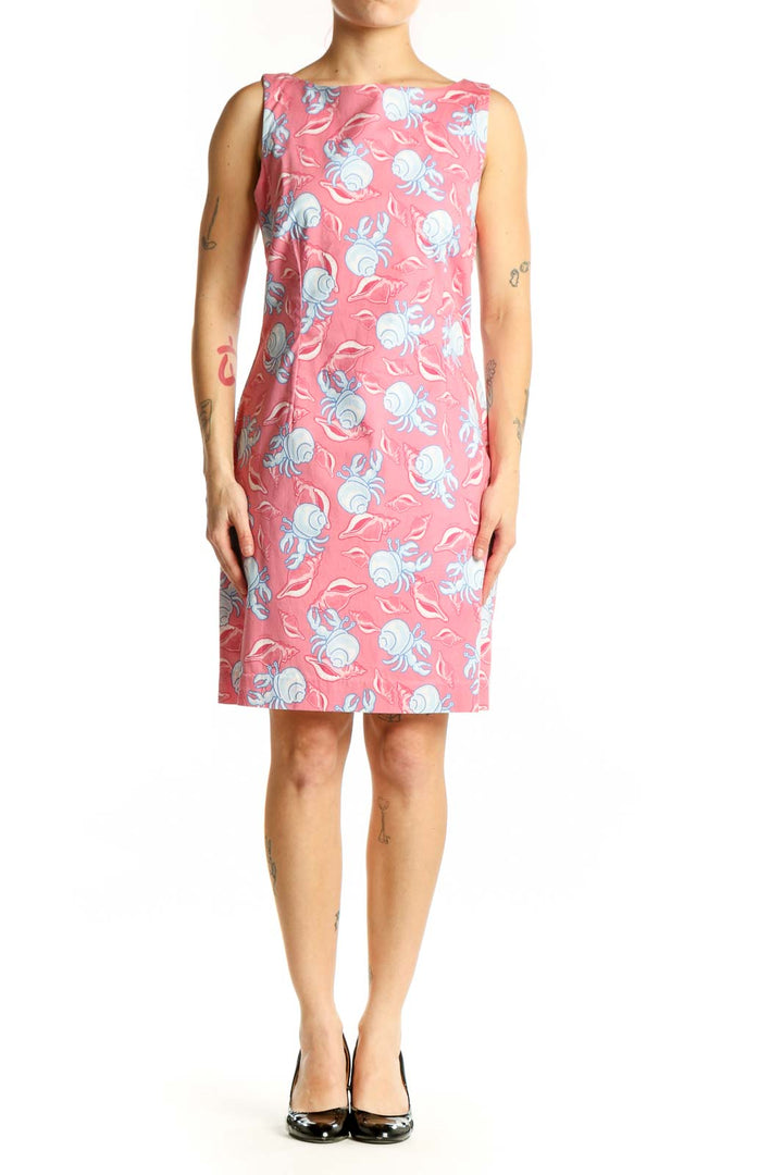 Pink floral sleeveless dress with blue and white flowers, boat neckline, front view