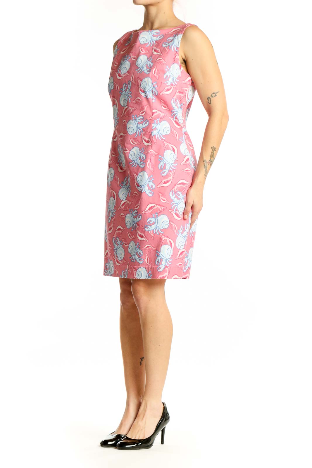Pink floral sleeveless dress with blue and white flowers, boat neckline, front view
