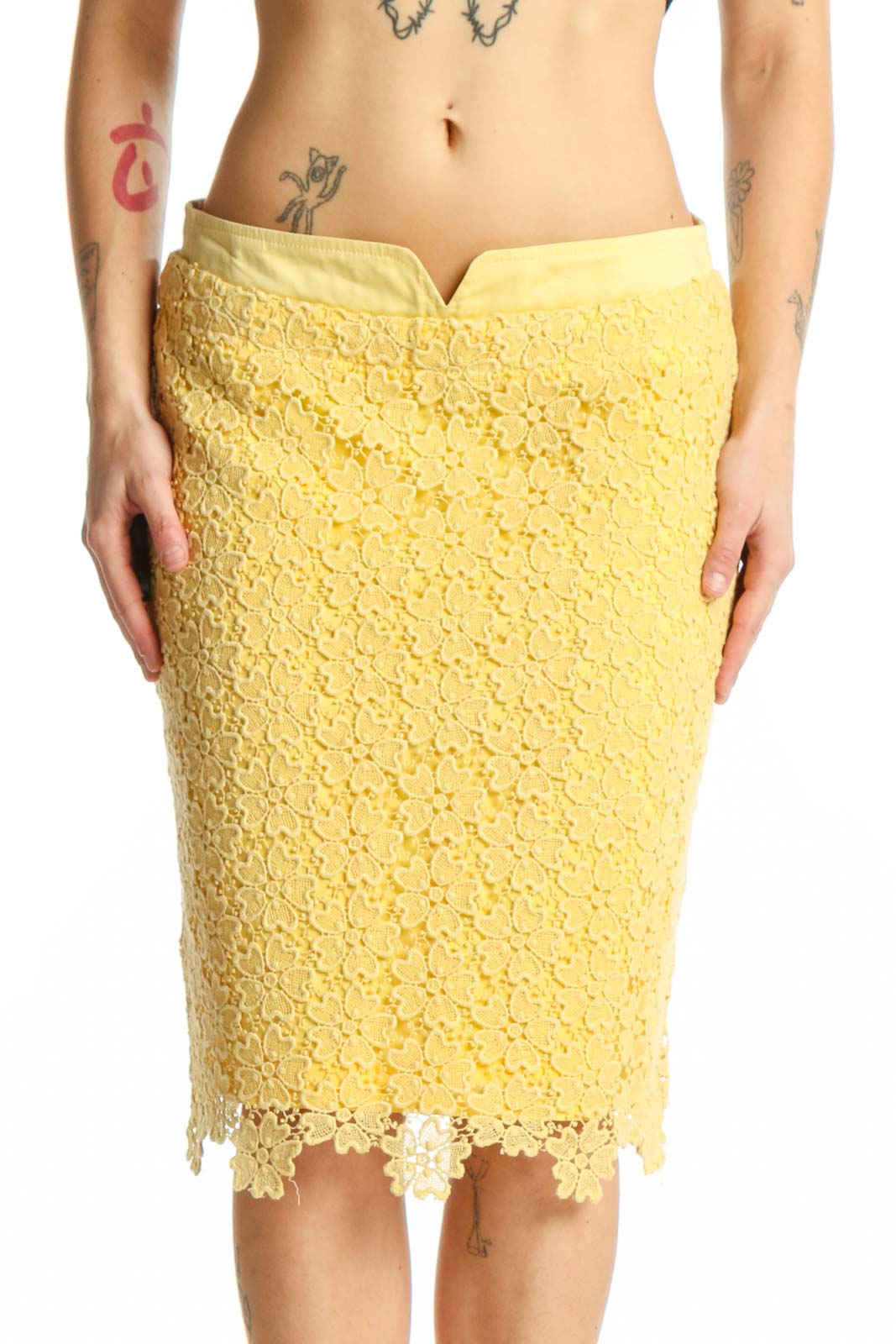 Yellow lace pencil skirt with scalloped edges and intricate lace detailing, front view