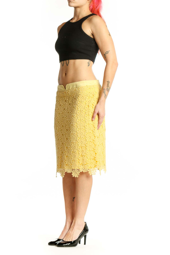 Yellow lace pencil skirt with scalloped edges and intricate lace detailing, front view